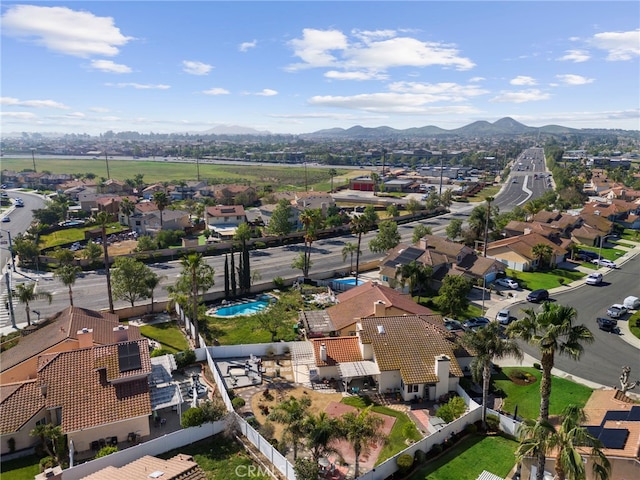 drone / aerial view featuring a residential view and a mountain view