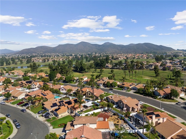birds eye view of property featuring a water and mountain view and a residential view