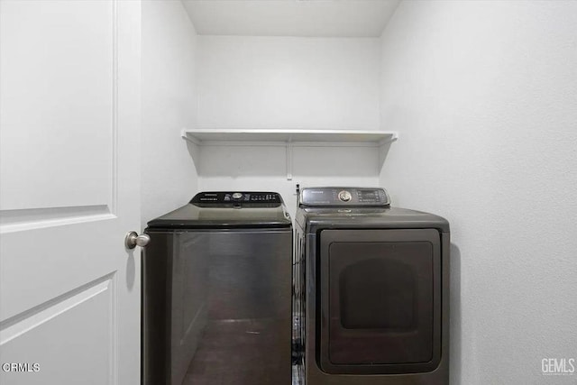 washroom with washer and dryer and laundry area