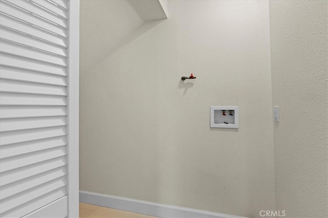 laundry room featuring laundry area, baseboards, and hookup for a washing machine