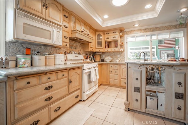 kitchen with light tile patterned floors, tasteful backsplash, light brown cabinetry, custom exhaust hood, and white appliances