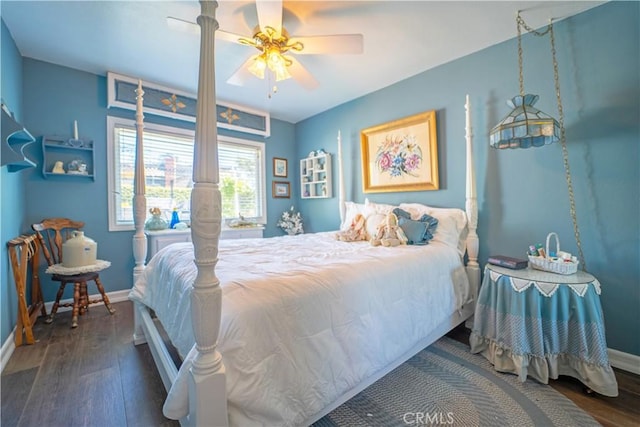 bedroom with hardwood / wood-style floors, baseboards, and a ceiling fan