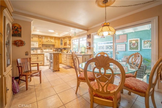 dining room with light tile patterned flooring, crown molding, a tray ceiling, and recessed lighting
