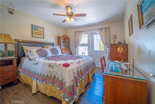 bedroom with dark wood-type flooring and ceiling fan