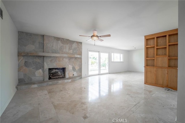 24492 Spartan St, Mission Viejo, CA 92691 - unfurnished living room with ceiling fan and a stone fireplace