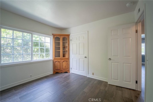 24492 Spartan St, Mission Viejo, CA 92691 - unfurnished bedroom featuring dark wood-type flooring and baseboards