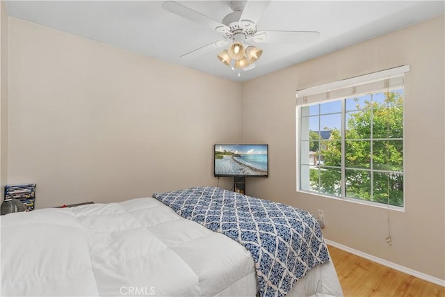 2548 S Young Ct, San Bernardino, CA 92408 - bedroom with baseboards, ceiling fan, and wood finished floors