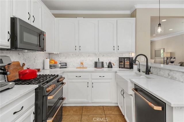 2548 S Young Ct, San Bernardino, CA 92408 - kitchen featuring double oven range, black microwave, dishwasher, a peninsula, and ornamental molding