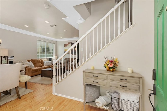 2548 S Young Ct, San Bernardino, CA 92408 - stairs featuring crown molding, recessed lighting, wood finished floors, and visible vents