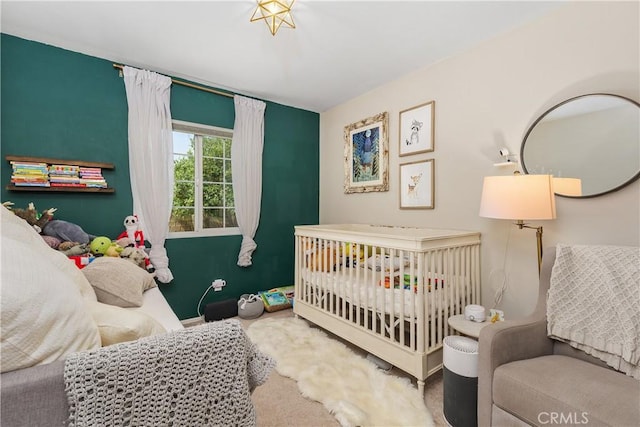 2548 S Young Ct, San Bernardino, CA 92408 - carpeted bedroom with a nursery area