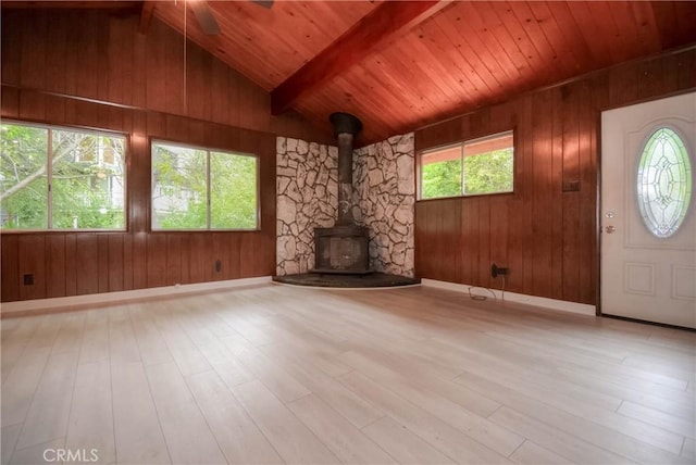 14109 Meadow Ln, Lytle Creek, CA 92358 - unfurnished living room featuring wood ceiling, wood finished floors, lofted ceiling with beams, and a wood stove