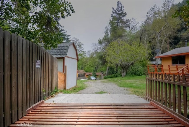 14109 Meadow Ln, Lytle Creek, CA 92358 - view of gate with a lawn, an outdoor structure, and a shed