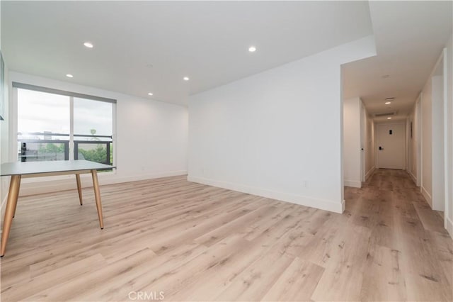 5652 La Mirada Ave, Los Angeles, CA 90038 - spare room with recessed lighting, light wood-style floors, and baseboards