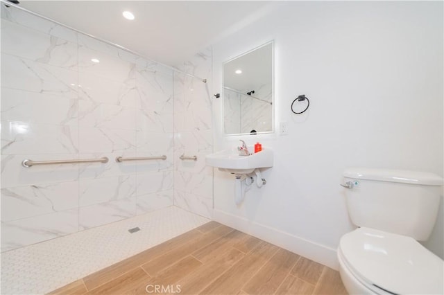 5652 La Mirada Ave, Los Angeles, CA 90038 - full bathroom featuring toilet, walk in shower, recessed lighting, and wood finished floors