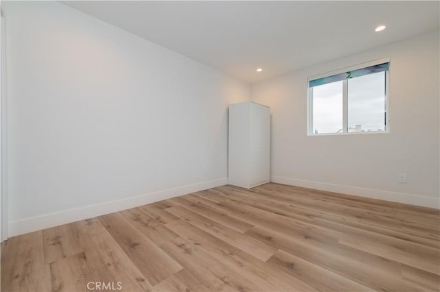 5652 La Mirada Ave, Los Angeles, CA 90038 - spare room with baseboards, light wood-style flooring, and recessed lighting