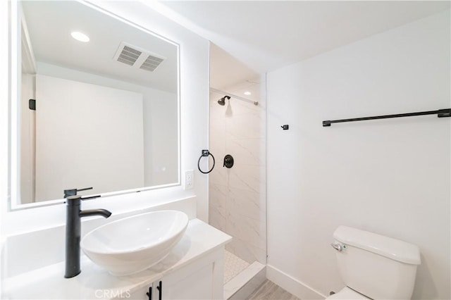 5652 La Mirada Ave, Los Angeles, CA 90038 - full bathroom with a stall shower, toilet, visible vents, and a sink