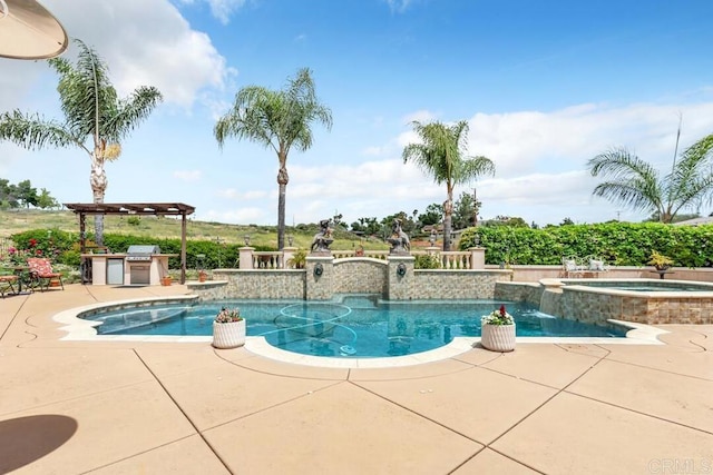 view of swimming pool with a patio area, exterior kitchen, a pool with connected hot tub, and area for grilling