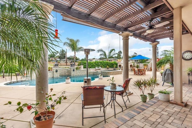 view of patio with a pergola, ceiling fan, a pool with connected hot tub, and outdoor dining space