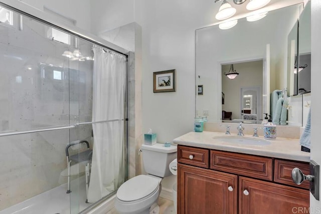bathroom with vanity, ensuite bathroom, a shower stall, and toilet