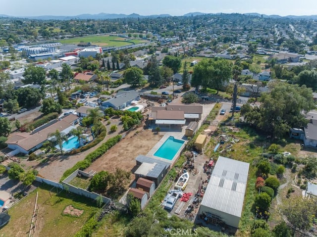 birds eye view of property featuring a mountain view