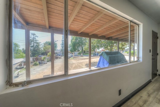 interior space with beam ceiling and plenty of natural light