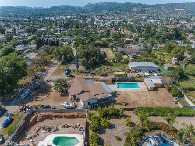 drone / aerial view featuring a mountain view