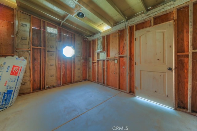 misc room with concrete flooring