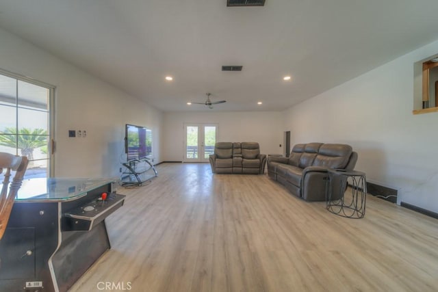 living room with wood finished floors, recessed lighting, and visible vents