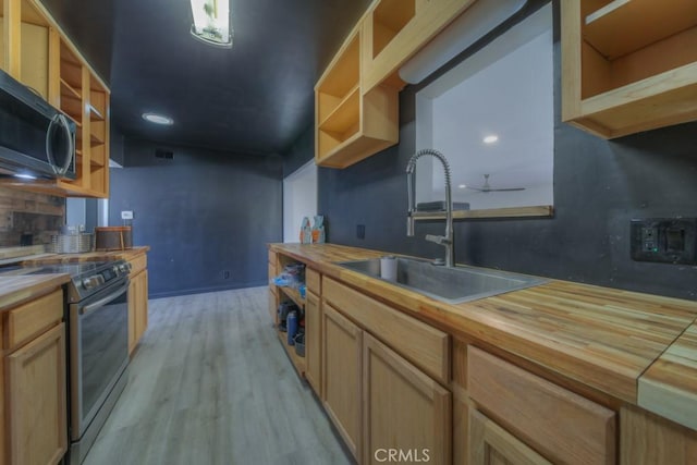 kitchen featuring wood counters, stainless steel appliances, and open shelves
