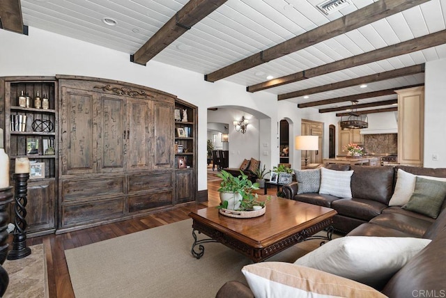 living room with arched walkways, visible vents, wood ceiling, and dark wood-type flooring