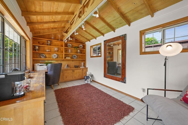 office with wooden ceiling, built in shelves, light tile patterned floors, vaulted ceiling with beams, and track lighting