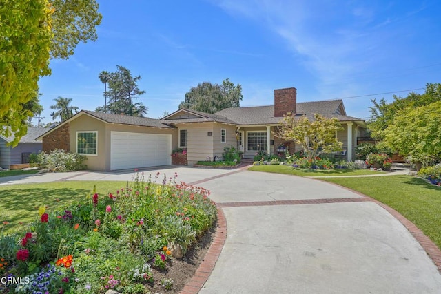 ranch-style home featuring a chimney, concrete driveway, a front lawn, and a garage