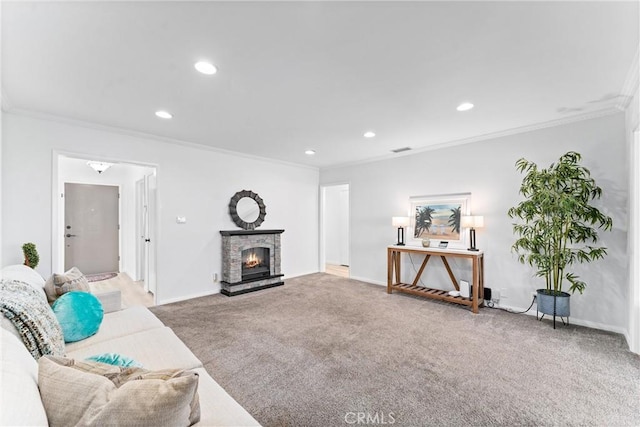 carpeted living area with crown molding, recessed lighting, a stone fireplace, and baseboards