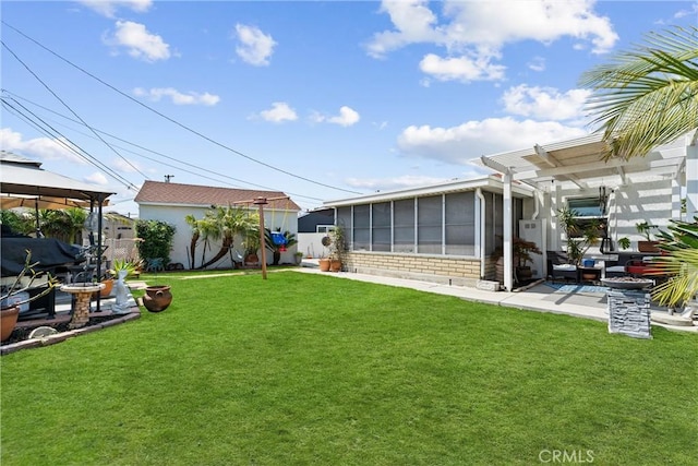 view of yard featuring a gazebo, a patio, and a sunroom