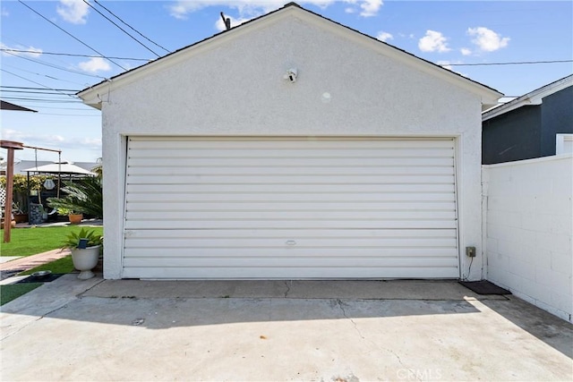 detached garage with fence