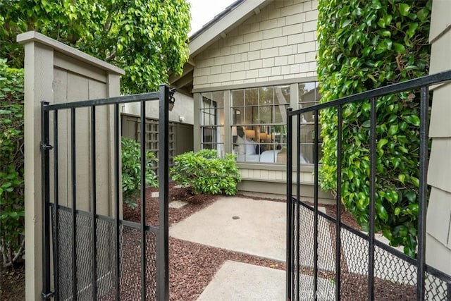 view of gate with fence