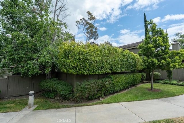 view of home's exterior with fence