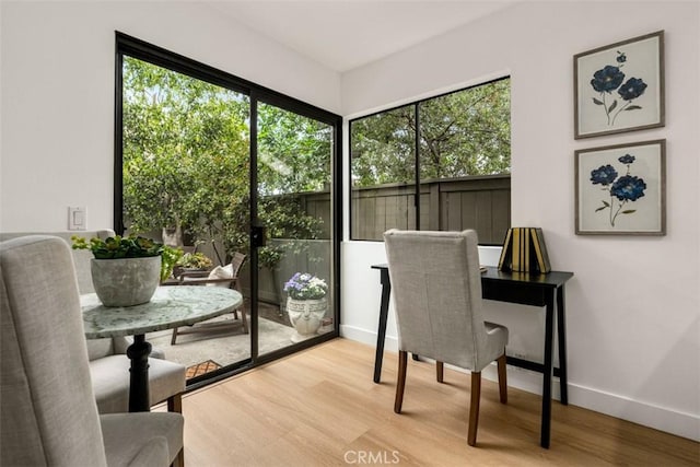 interior space featuring baseboards and wood finished floors