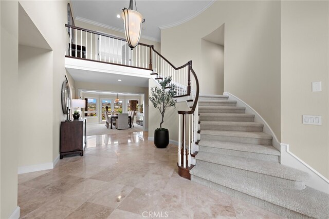 27561 Silver Creek Dr, San Juan Capistrano, CA 92675 - foyer with stairs, marble finish floor, ornamental molding, baseboards, and a high ceiling