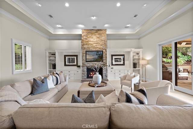 27561 Silver Creek Dr, San Juan Capistrano, CA 92675 - living area with crown molding, visible vents, a stone fireplace, and a healthy amount of sunlight