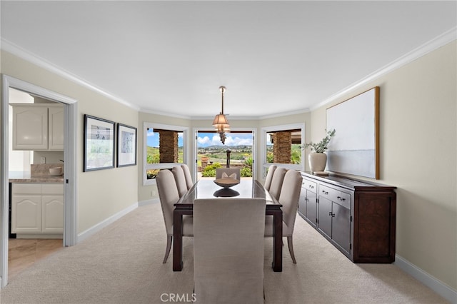 27561 Silver Creek Dr, San Juan Capistrano, CA 92675 - dining room featuring a healthy amount of sunlight, crown molding, baseboards, and light carpet