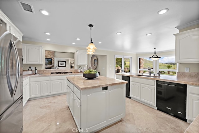 27561 Silver Creek Dr, San Juan Capistrano, CA 92675 - kitchen featuring a sink, visible vents, a kitchen island, freestanding refrigerator, and black dishwasher
