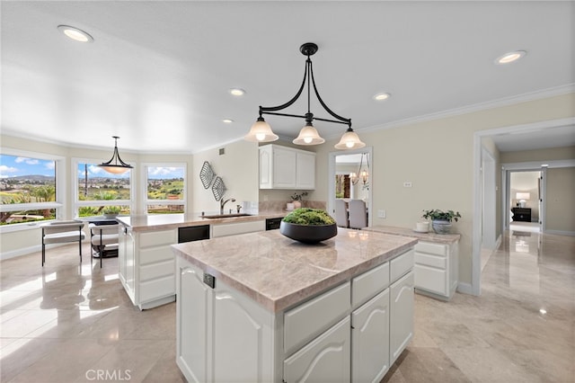 27561 Silver Creek Dr, San Juan Capistrano, CA 92675 - kitchen with a peninsula, a kitchen island, light countertops, ornamental molding, and white cabinets