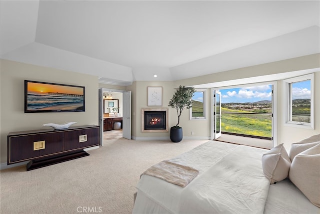 27561 Silver Creek Dr, San Juan Capistrano, CA 92675 - carpeted bedroom with a glass covered fireplace, ensuite bath, access to outside, and baseboards