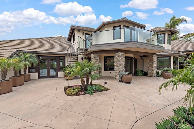 27561 Silver Creek Dr, San Juan Capistrano, CA 92675 - back of property featuring stucco siding, a patio, a tile roof, french doors, and a balcony
