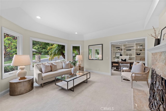 27561 Silver Creek Dr, San Juan Capistrano, CA 92675 - carpeted living area with a high end fireplace, recessed lighting, and baseboards
