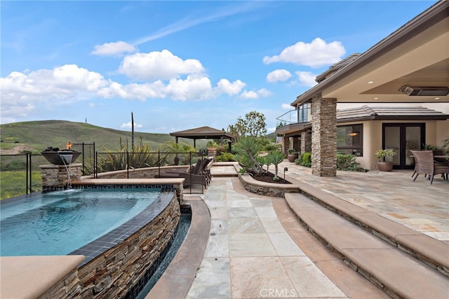 27561 Silver Creek Dr, San Juan Capistrano, CA 92675 - view of swimming pool with a mountain view, a fenced in pool, french doors, and a patio area