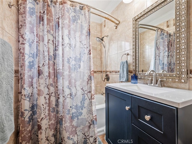 full bath featuring shower / tub combo, crown molding, tile walls, and vanity