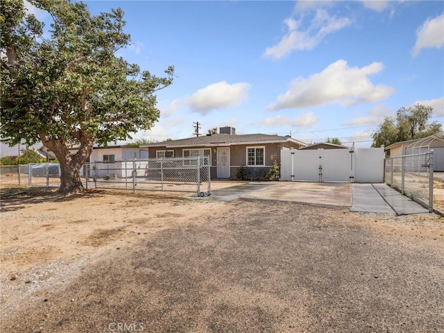 ranch-style house featuring a gate and fence private yard