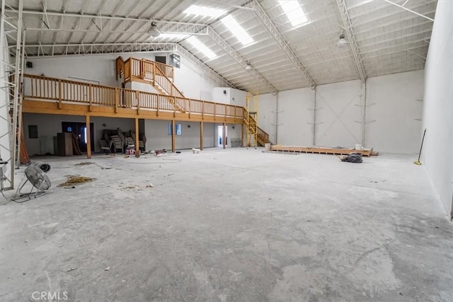 misc room with high vaulted ceiling